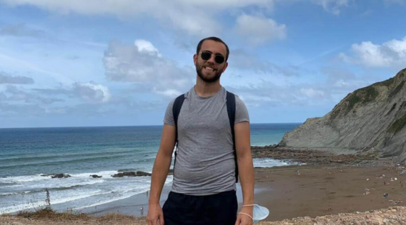 a man standing on a beach.