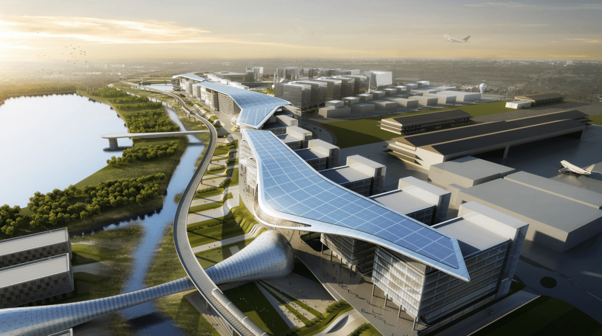 Futuristic aerial view of a smart city or airport complex with solar-panel-covered buildings, modern infrastructure, surrounding water bodies, and an airplane taking off in the background.