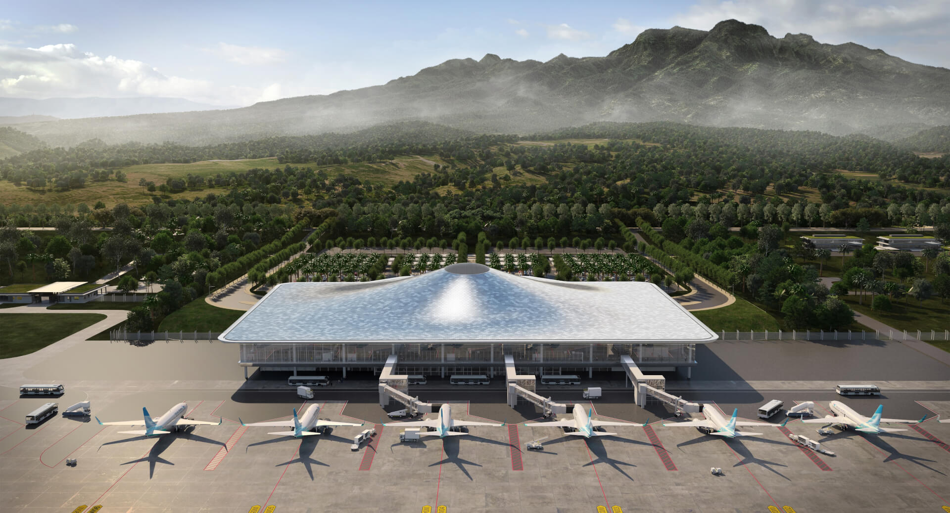 A modern airport terminal with a unique curved roof design, surrounded by lush greenery and mountains in the background, with several airplanes parked at gates and ground vehicles nearby.