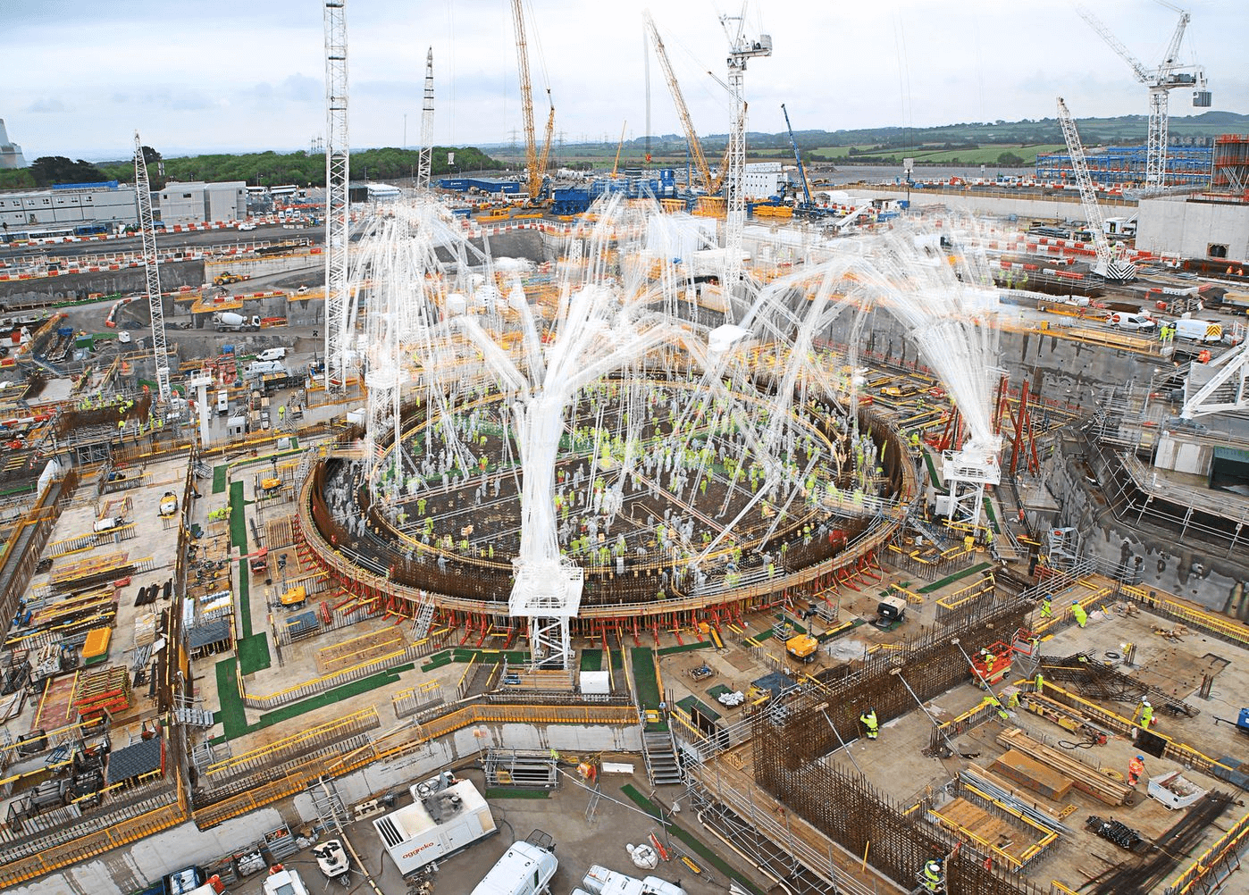 Construction site with cranes and circular foundation