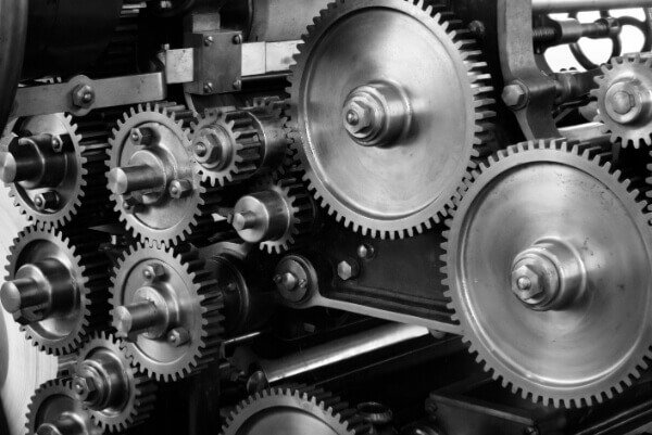 Close-up of interlocking mechanical gears in motion