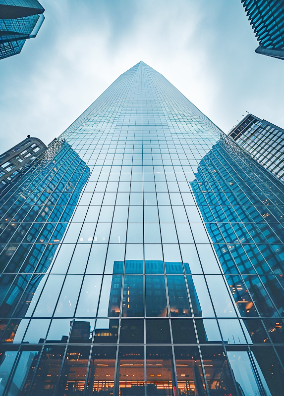 Tall glass skyscraper from below