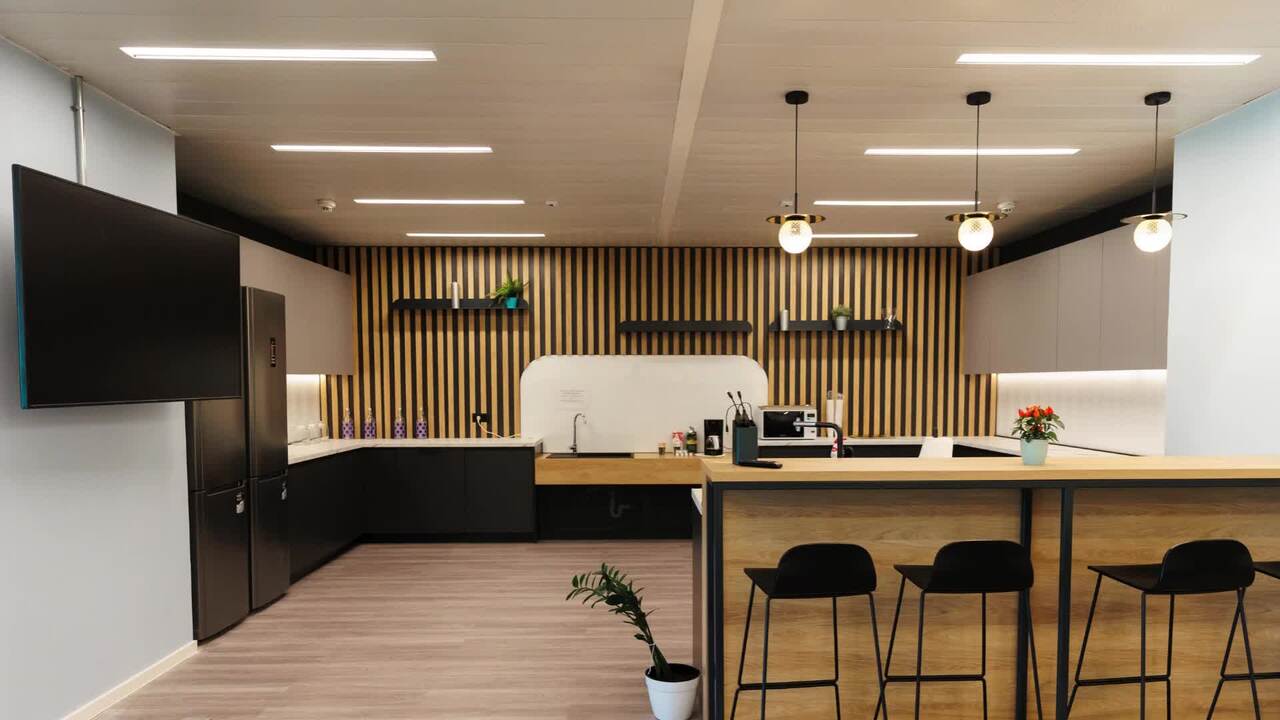 Contemporary office kitchen area with modern furnishings