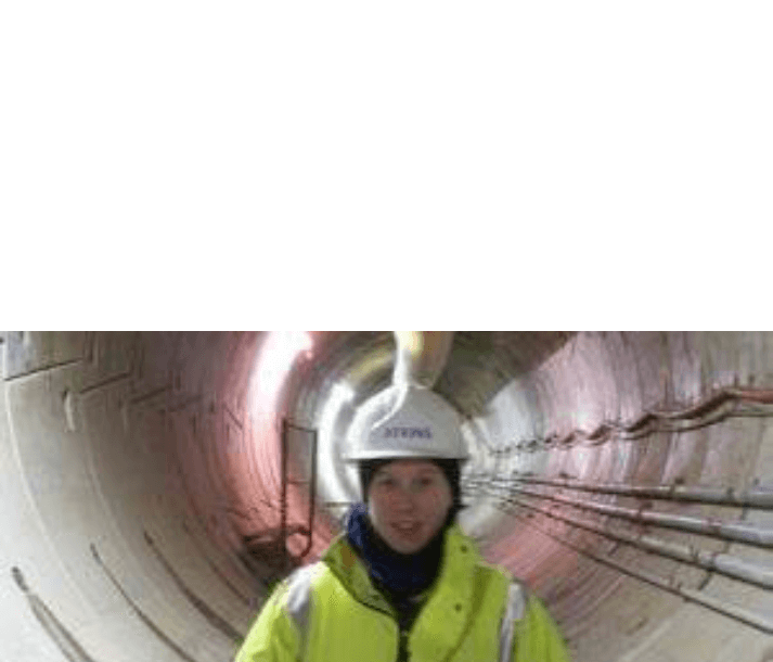 Worker in tunnel wearing Atkins hard hat and high-vis jacket