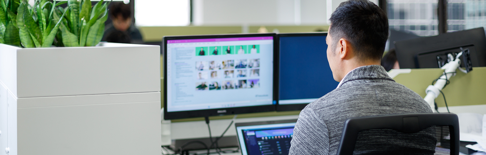 a man working on computer in office