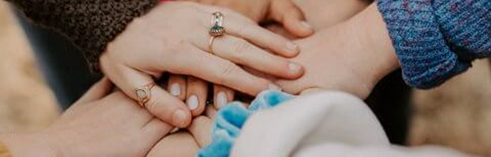 Hands joined together symbolizing unity and teamwork