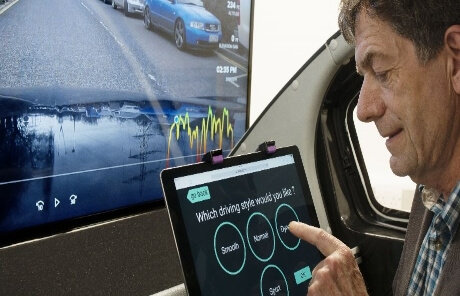 a man having tab on his hand.