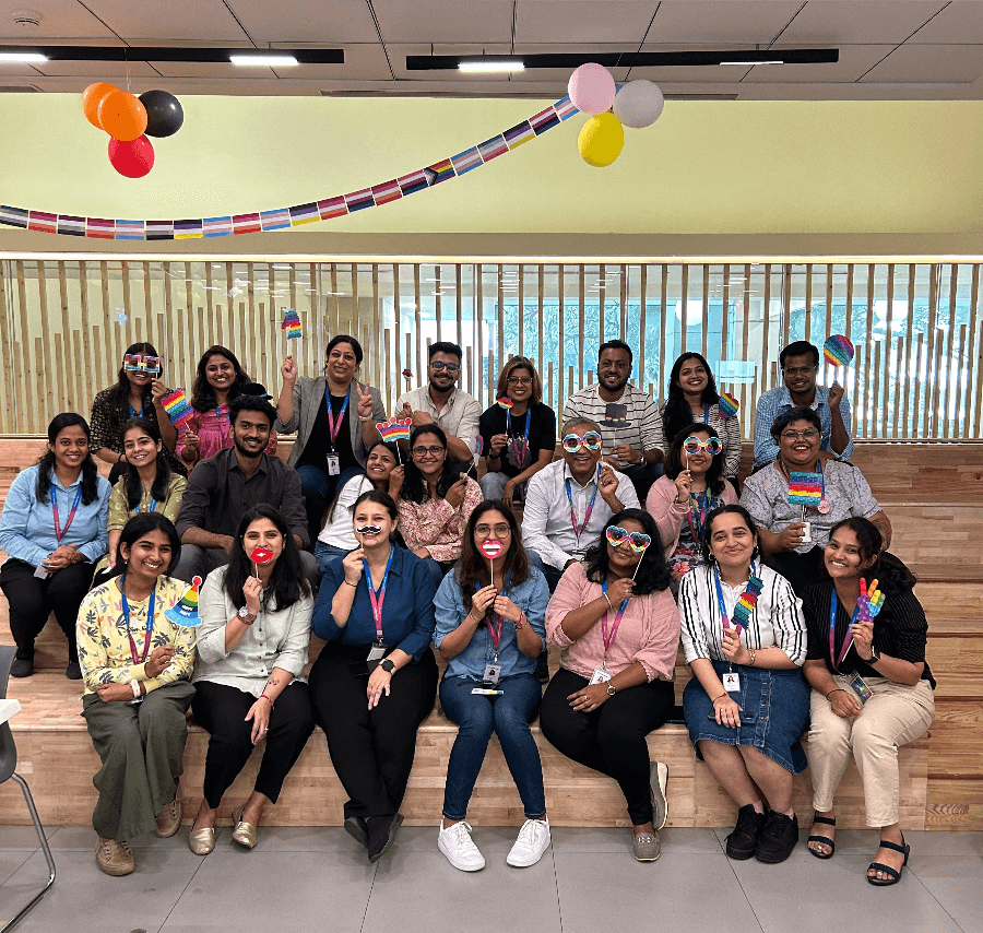 Image of employees posing for a picture after a fruitful discussion at office.