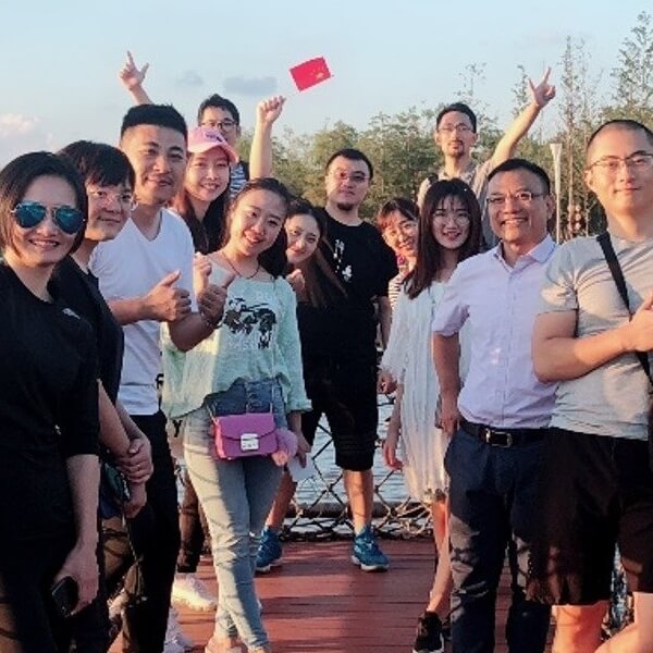 team in Asia celebrating positive corporate culture