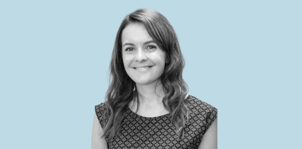 Portrait of a smiling woman in patterned dress
