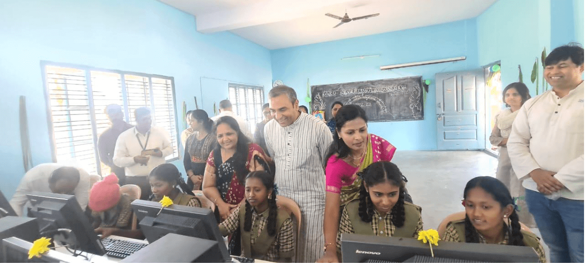 Atkins employees helping children with new computers