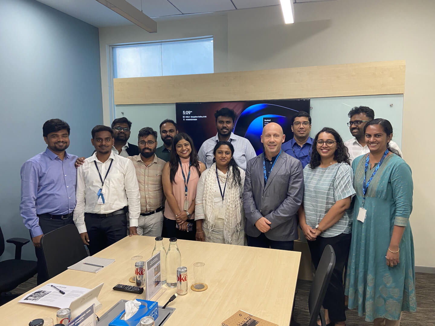 Group of people standing in an indoor exhibition