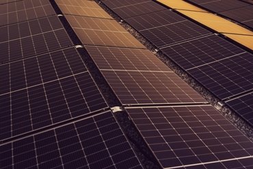 dark moody photo of some large solar panels