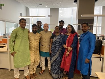 Group of people standing in an indoor exhibition