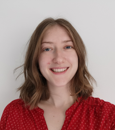 Woman smiling wearing red top