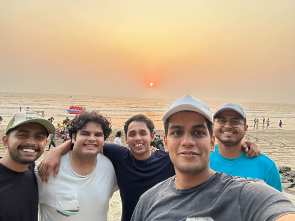 Chinmay with a group on beach