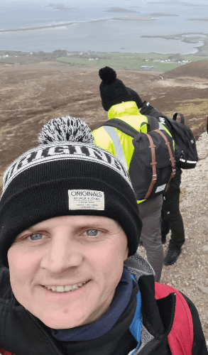 Picture of Kevin trekking on a hill