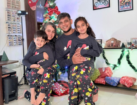 Family photo of Angela's in their xmas pyjamas