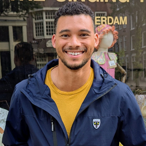Headshot of Aston smiling