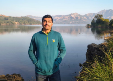 Mohit standing in front of lake