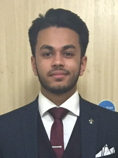 photo of Maroof smiling at the camera