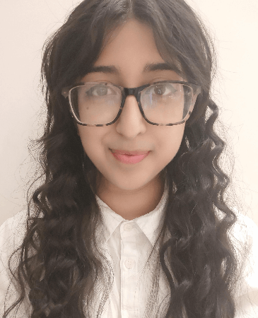 Photo of Aishah smiling towards the camera